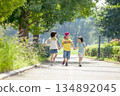 Three children playing in the park 134892045