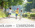 Three children playing in the park 134892046