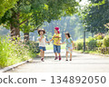 Three children playing in the park 134892050