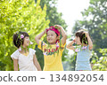 Three children playing in the park 134892054