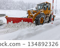 Snowplow that removes snow from the road 134892326
