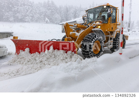 Snowplow that removes snow from the road Snowplow that removes snow from the road 134892326