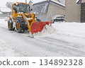 Snowplow that removes snow from the road 134892328
