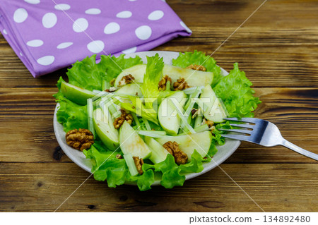 Waldorf salad on a wooden table Waldorf salad on a wooden table 134892480