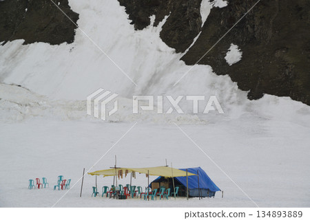 Villagers' tents are provided for tourists to use while skiing at Zero Point is a viewpoint located in Sonamarg, Kashmir, India , it is known for its beautiful scenery of vast grasslands and snow-capp 134893889