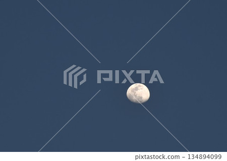 half moon floating on blue sky in twilight background  134894099