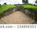 Classic arched entrance at Daulatabad Fort is an ancient fort located in Maharashtra, India. Originally named Deogiri, it is a fort built from natural rocks and is very strong. 134894303