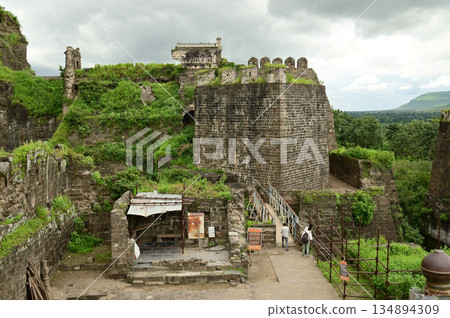 Tourists visit in Daulatabad fort , Built with massive stone walls showcasing medieval military architecture and cultural heritageIt. Tourists visit in Daulatabad fort , Built with massive stone walls showcasing medieval military architecture and cultural heritageIt. 134894309