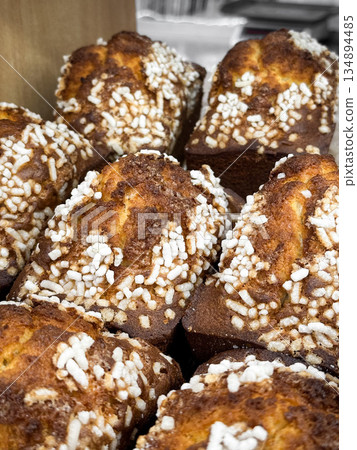 Close-up of sugar-topped loaf cakes in a bakery. 134894485