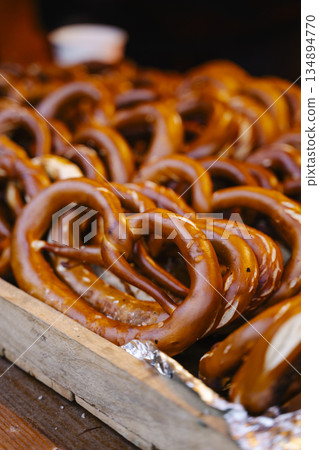 Traditional Fresh Baked German Pretzels with Salt in a Basket Traditional Fresh Baked German Pretzels with Salt in a Basket 134894770
