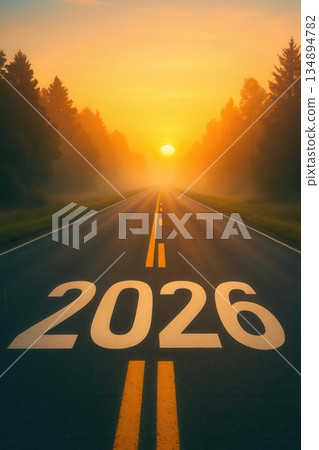 Looking ahead to 2026: A road to future vision. The image features the road towards 2026 with a beautiful sunrise sky in background. 134894782