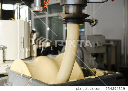 Industrial butter processing machine in food factory Industrial butter processing machine in food factory 134894819