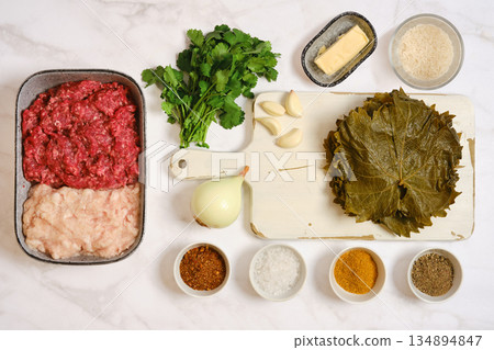 Preparation of ingredients for cooking stuffed grape leaves in the kitchen Preparation of ingredients for cooking stuffed grape leaves in the kitchen 134894847