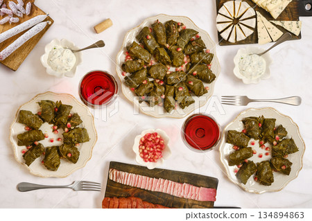 Delicious table set with stuffed grape leaves and other dishes for a gathering 134894863