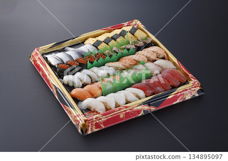 A luxurious takeaway sushi platter perfect for parties and family gatherings 134895097