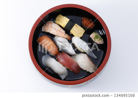 A single serving of Edomae nigiri sushi served in a traditional sushi tub A single serving of Edomae nigiri sushi served in a traditional sushi tub 134895108
