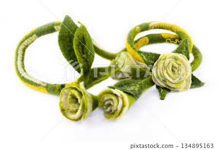 Harness of fulled wool with flower on a white background 134895163