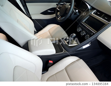 Top view of front seats, dashboard and controls panel in leather car interior  134895164
