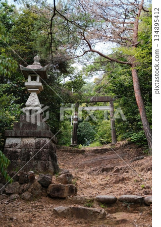 Ancient Stone Gateway Amid Lush Greenery Ancient Stone Gateway Amid Lush Greenery 134895412