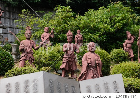 Ancient Stone Guardians of Peaceful Temple Garden Ancient Stone Guardians of Peaceful Temple Garden 134895484