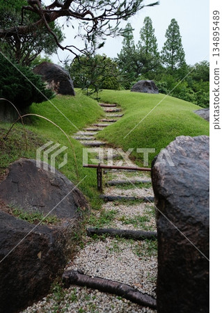 Green Garden Path Amongst Stone Landscapes Green Garden Path Amongst Stone Landscapes 134895489