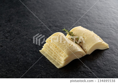 Cheese slices folded like an open book. Cheese slices folded like an open book. 134895538