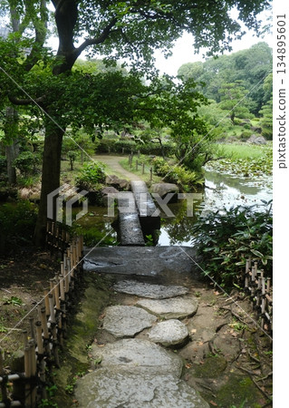 Ancient Stone Bridge Over Quiet Stream Ancient Stone Bridge Over Quiet Stream 134895601