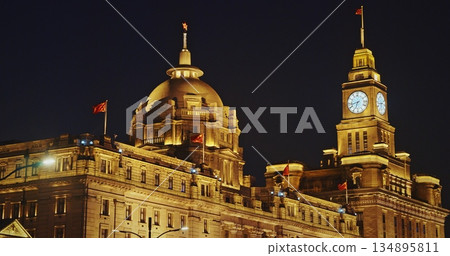 Shanghai, China. Clock tower of Shanghai, soaring beautifully at night. The Bund, Shanghai Custom House Building, The Clock Tower Shanghai, China. Clock tower of Shanghai, soaring beautifully at night. The Bund, Shanghai Custom House Building, The Clock Tower 134895811