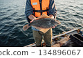A man who caught a flounder by fishing 134896067