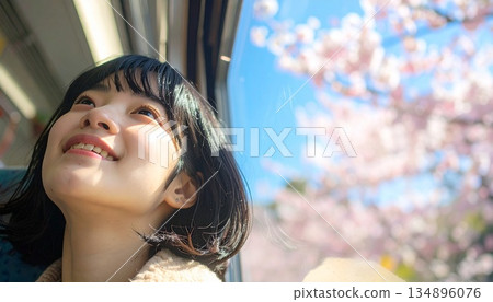 A woman riding a train (spring image cut) 134896076