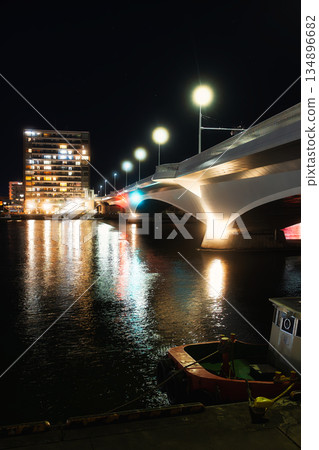A quiet night view of a port town and a modern bridge 134896682