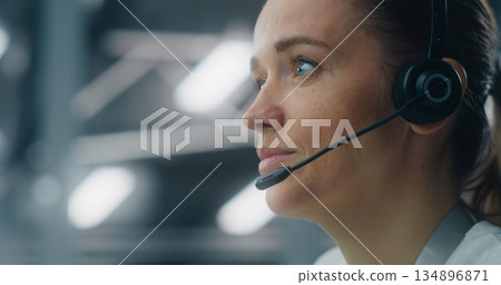 Dedicated Female Technician Responding to Real Time System Alerts Dedicated Female Technician Responding to Real Time System Alerts 134896871