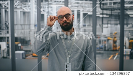 Bearded Engineer With Glasses, Looking Directly With Professional Demeanor 134896897