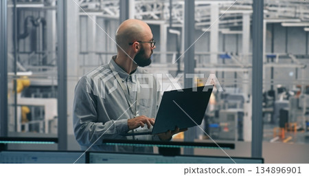 Engineer Tracking Production Process With Handheld Device Engineer Tracking Production Process With Handheld Device 134896901