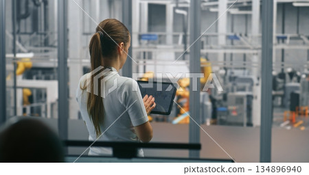 Female Engineer Managing Production Via Tablet 134896940