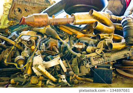 Parts of dismantled cars. Scrap metal parts for old cars 134897081