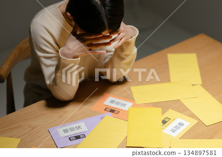 A woman troubled by a demand letter 134897581
