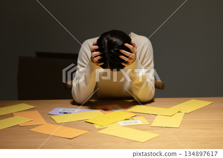 A woman troubled by a demand letter A woman troubled by a demand letter 134897617