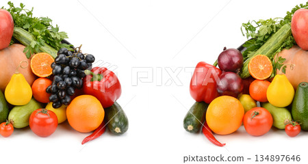 Vibrant fruits and vegetables arranged in two symmetrical piles. 134897646