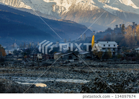 A mountain range with a small town in the valley. Mestia, Georgia A mountain range with a small town in the valley. Mestia, Georgia 134897674