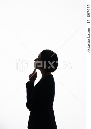 Silhouette of a worried woman 134897685