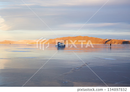 A hovercraft on the transparent ice of the frozen Lake Baikal. A hovercraft on the transparent ice of the frozen Lake Baikal. 134897832