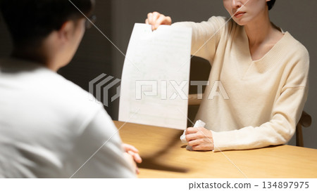 Woman presenting divorce papers Woman presenting divorce papers 134897975