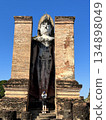 The UNESCO-listed upright statue at Wat Mahathat in Sukhothai Historical Park 134898049
