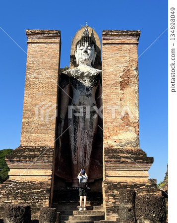 The UNESCO-listed upright statue at Wat Mahathat in Sukhothai Historical Park 134898049