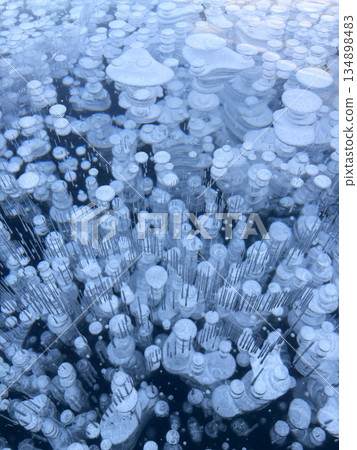 Ice bubbles create a stunning pattern on frozen Lake Baikal. 134898483