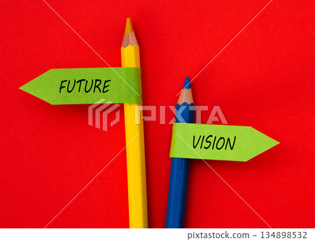 Pencils holding future vision concept signs on red background Pencils holding future vision concept signs on red background 134898532