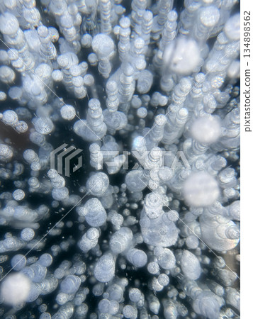 Ice bubbles create a stunning pattern on frozen Lake Baikal. Ice bubbles create a stunning pattern on frozen Lake Baikal. 134898562