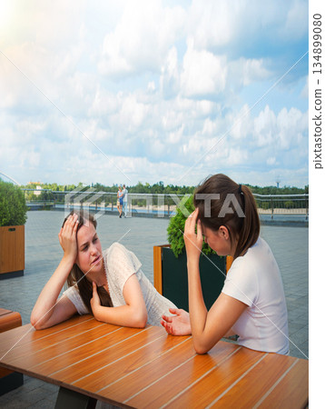 Young girls in a cafe Young girls in a cafe 134899080