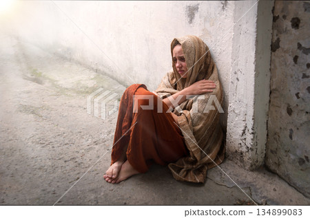 Frozen girl sitting on the floor 134899083